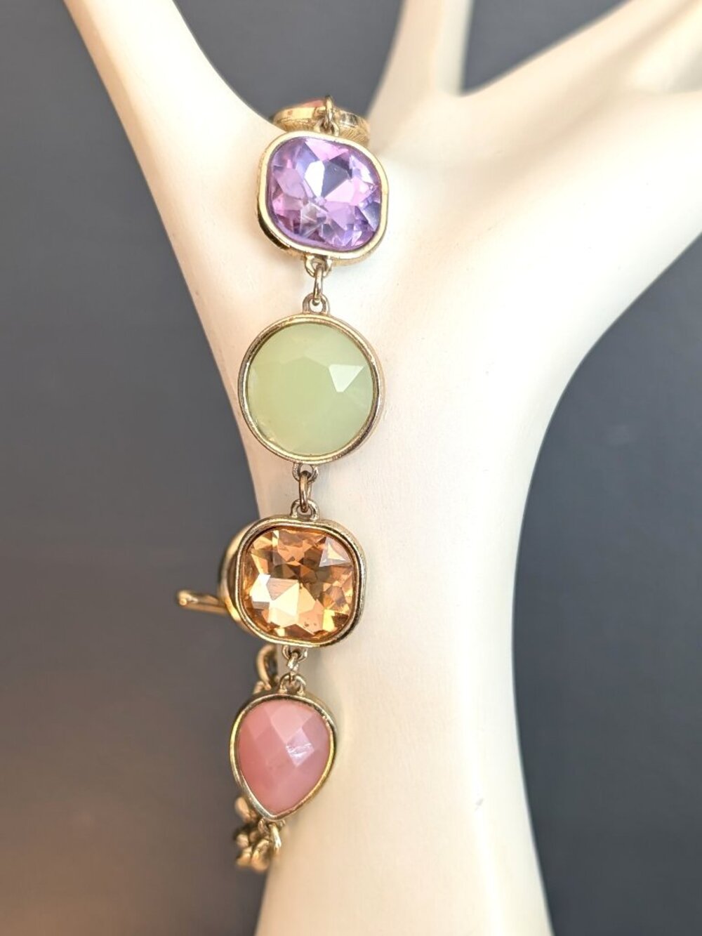 Peach, purple, green, orange and mauve beaded gold tone bracelet